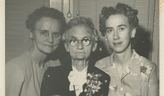 Photo of older woman with glasses and her two daughters