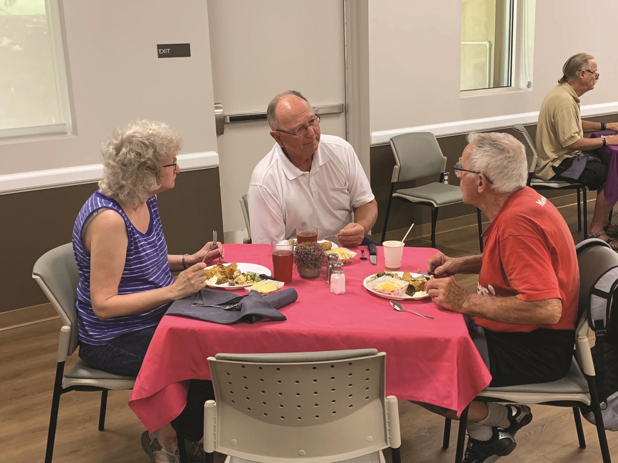 three seniors eating lunch at Brooks Cafe