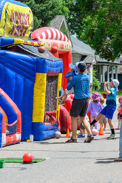 People enjoying games at block party