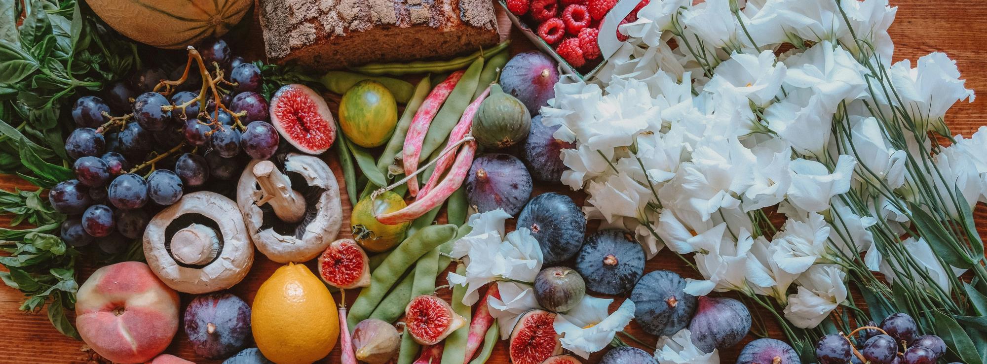 Fruits and vegetables spread out on a table.