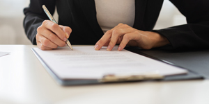 Person filling out forms